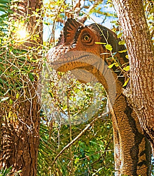 Dinosaur Peeking Around Tree