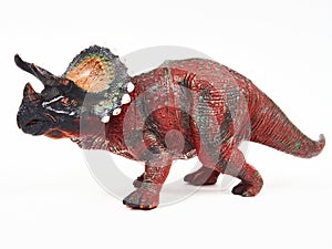 Dinosaur triceratops rubber toy isolated on white