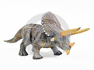 Dinosaur triceratops rubber toy isolated on white