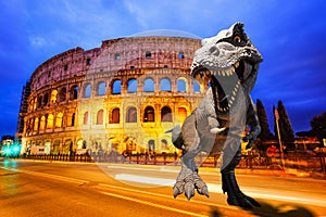 Dinosaurs model on Twilight view of Colosseum in Rome