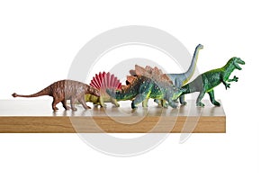 Dinosaurs walking off a ledge