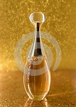 Dior perfume gold bottle close-up macro texture abstract light photo