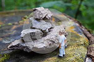 Diorama of man and rocks photo