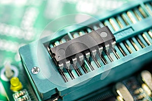 DIP microcontroller in the ZIF socket of programming adapter. Electronic software engineering