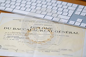 Diplom Baccalaureate certificate on a wooden table in France