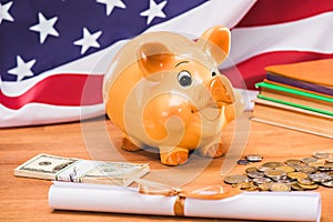 Diploma and piggy bank with coins and dollars usa flag behind