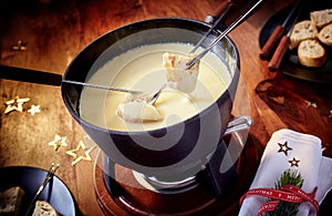 Dipping bread into a delicious cheese fondue