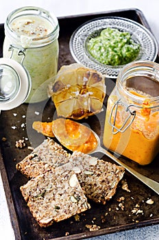 Dips and spread with seeded bread as a snack