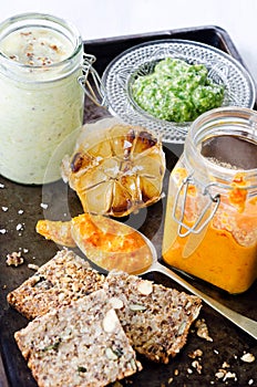 Dips and spread with seeded bread as a snack