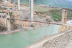 Cizhong Bridge at Lancang River. a famous Tibetan village of Diqing, Yunnan, China. photo