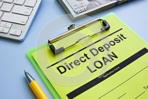 Direct deposit loan application form and pen.