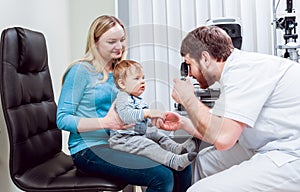 Direct ophthalmoscopy. Retinal examination. Fundoscopy. Child vision test.