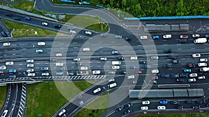 Direct view from above to the road traffic. Traffic jam at a highway junction. Aerial Drone Flight top down View of