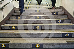 Direction arrows on steps on Tokyo subway