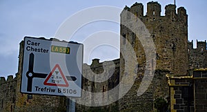 Direction sign in background of Conway castle building