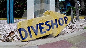 A direction sign of dive shop