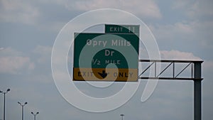 Direction sign to Opry Mills on the freeway - NASHVILLE, UNITED STATES - JUNE 17, 2019