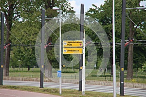 Direction sign in Yellow heading the Emergency route for Ambulance entry of Utrecht hospital UMC and SEH