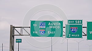 Direction signs to Austin and Waco on the highway