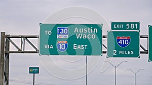 Direction signs to Austin and Waco on the highway