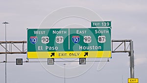 Direction signs to Houston and San Jose on the highway