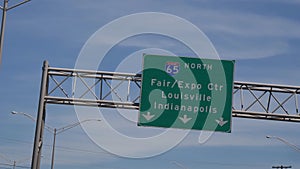 Direction signs to Louisville and Indianapolis on the highway