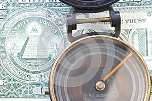 Direction & $ US dollar 3485 Spinning compass, one dollar bill