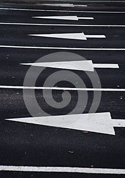 Directional arrows on asphalt