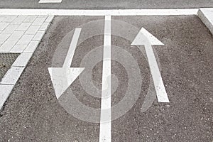 Directional arrows on the asphalt