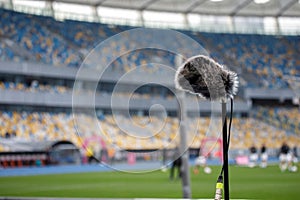 Directional microphone on the football field to record the sound of the match