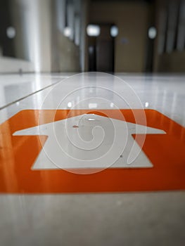 directional sign on the floor