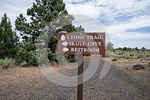 Directional sign in Lava Beds National Monument leads hikers to restrooms, caves and the Lyons Trail