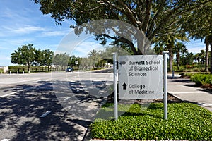 The directional sign pointing to Burnett School of Biomedical Sciences and the College of Medicine at the University of Central