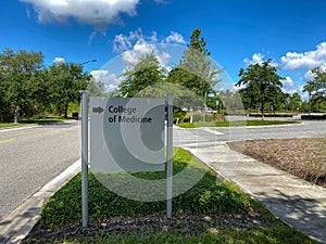 The directional sign pointing to College of Medicine at the University of Central Florida School of Medicine