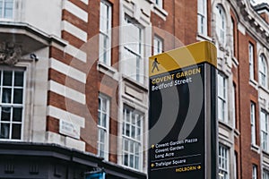 Directional signs in Bedford Street, Covent Garden, London, UK