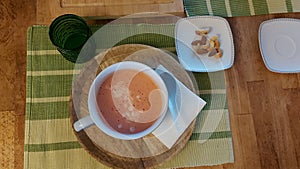 Directly above image of breakfast. Cup of strawberry, banana and yogurt mueslu.