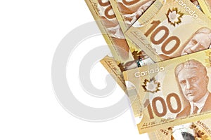 Directly Above Image of Crisp Canadian 100 One Hundred Dollar Bills on a White Background