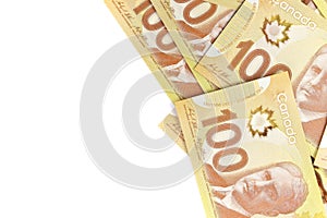 Directly Above Image of Crisp Canadian 100 One Hundred Dollar Bills on a White Background