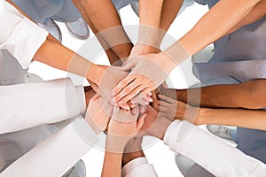 Directly Above Shot Of Medical Team Standing Hands