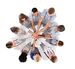 Directly Above Shot Of Multiethnic Medical Team Stacking Hands photo