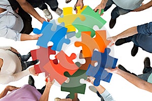 Creative Business People Holding Colorful Puzzle Pieces