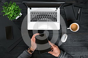 Directly above view of human hands typing on laptop.