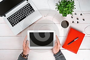 Directly above view of human hands typing on laptop.