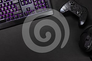 Purple lit keyboard by game controller and mouse