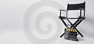 Director chair with black and yellow clapper board or movie slate on white background.it is used in video production and film