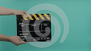 Director Film Slate. Film crew hold and clapping film slate in video recording