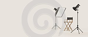 Director\'s chair and photo studio equipment on copy space background