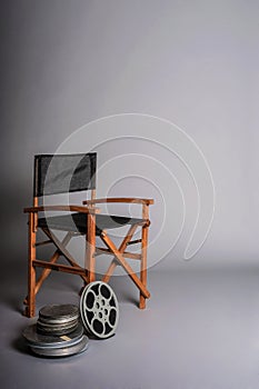 Film director's chair with movie reel photo