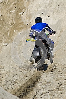 Dirt biker riding up hill