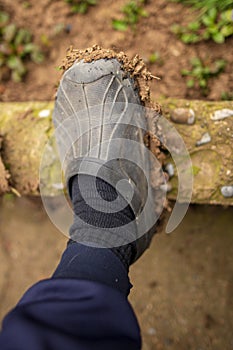 Dirt on a galosh on foot